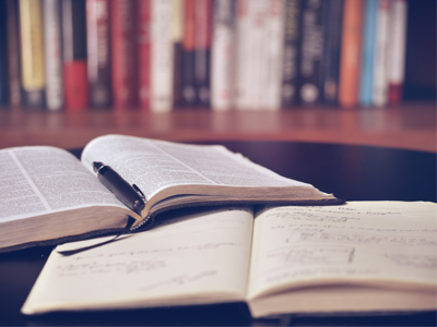 Open Bible and open notebook